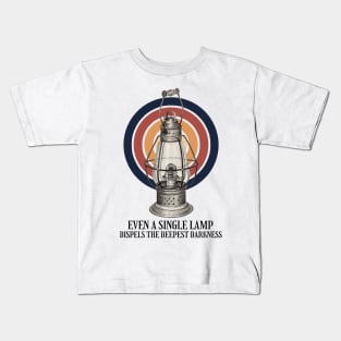 Even a single lamp dispels the deepest darkness Kids T-Shirt